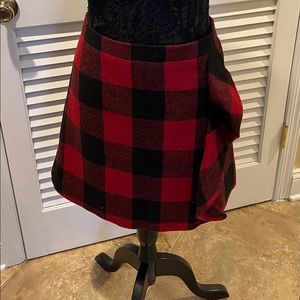 Black and red checkered skirt above the knee ruffle on the side size 12